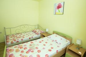 Postel nebo postele na pokoji v ubytování RELAXING HOME LUCE