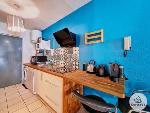 Η κουζίνα ή μικρή κουζίνα στο T1- Leko Réunion 3 étoiles - Proche des plages de l'Ouest