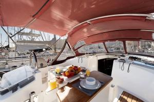 a table with a plate of fruit on a boat at Pato Lucas Sail Boat in San Sebastián de la Gomera