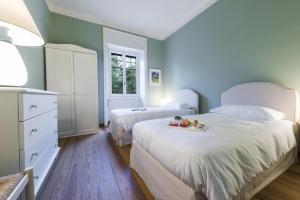 Кровать или кровати в номере Villa Angela +65 фотографий