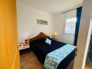 Katil atau katil-katil dalam bilik di Appartement Boug 27 Lumio