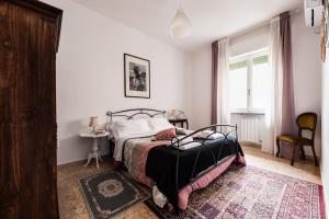 Postel nebo postele na pokoji v ubytování HomingPisa - Feeling Home