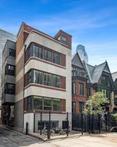 a building on a street next to some buildings at Japanese themed 2bedroom in Gold Coast for up to 4 guests with optional Valet parking in Chicago