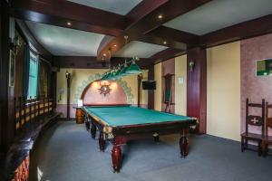 a billiard room with a pool table in it at Annushka Hotel in Saint Petersburg