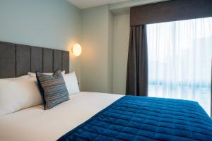 Aparthotel Birmingham客房内的一张或多张床位