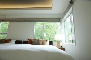 Кровать или кровати в номере KARUIZAWA Funny hours