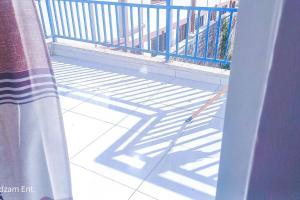 a view of a balcony with a blue railing at 1 bedroom with 2 beds, Mombasa Kisimani, Nyali in Mombasa