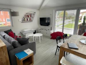 a living room with a couch and a table at Amt11 - Relax / family / home-office in Bad Wörishofen