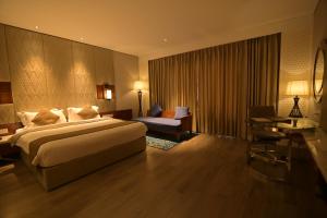 Hotel Amaravathi客房内的一张或多张床位