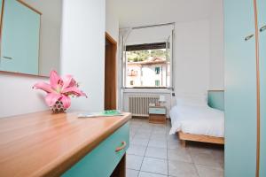 Postel nebo postele na pokoji v ubytování Hotel Martinelli