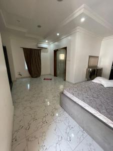 a bedroom with a large bed in a room at Frotech property in Lekki