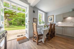 a kitchen and dining room with a table and chairs at The East Wing BB in Wymondham