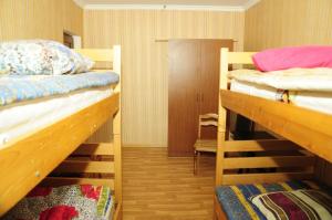 a room with two bunk beds in a room at Guesthouse in Sadgeri in Borjomi