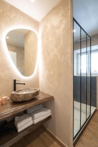a bathroom with a sink and a mirror at K1, appartement avec grande terrasse et vue pistes in Gérardmer