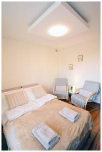 מיטה או מיטות בחדר ב-Color 24 Apartament V