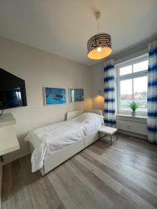 Ένα ή περισσότερα κρεβάτια σε δωμάτιο στο Villa Josephine App. 14