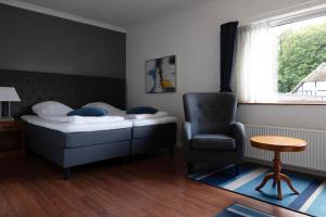 Postel nebo postele na pokoji v ubytování Helnan Marselis Hotel