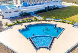 an overhead view of a swimming pool at a hotel at The Orchid Jamnagar in Jamnagar