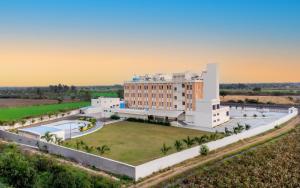 an aerial view of a resort with a large building at The Orchid Jamnagar in Jamnagar