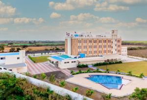 an aerial view of the resort with a swimming pool at The Orchid Jamnagar in Jamnagar