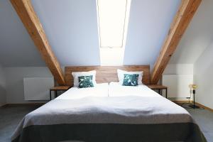 Ein Bett oder Betten in einem Zimmer der Unterkunft FOLGA - Hotel, Restauracja, Browar, SPA