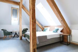 Ein Bett oder Betten in einem Zimmer der Unterkunft FOLGA - Hotel, Restauracja, Browar, SPA