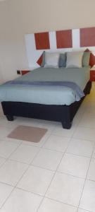 Ένα ή περισσότερα κρεβάτια σε δωμάτιο στο TSHABELANG MOUNTAIN VIEW LODGE