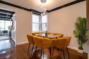 a dining room with a table and chairs at 4Bedroom Gold Coast Duplex with Jacuzzi in the Bedroom and Optional Valet Parking in Chicago