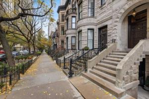 a building with a stone staircase in front of it at 4Bedroom Gold Coast Duplex with Jacuzzi in the Bedroom and Optional Valet Parking in Chicago
