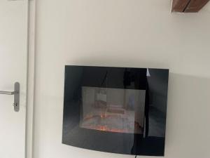 a fireplace in a wall with a fire in it at Zürich 3 Zimmer Wohnung mit Dachterrasse in Zürich