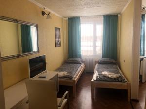 TV a/nebo společenská místnost v ubytování Riverside Motel Jelgava