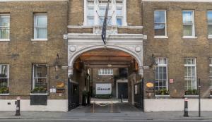 an entrance to a brick building with an arch at Montcalm Brewery, London City in London +37 photos