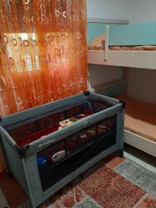 a dresser in a bedroom with a bunk bed at Apricot garden in Kynopiástai