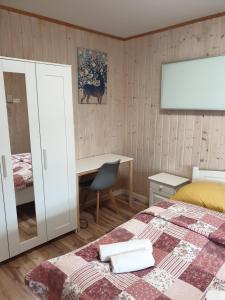 Posteľ alebo postele v izbe v ubytovaní Apartamenty pod Wilczakiem