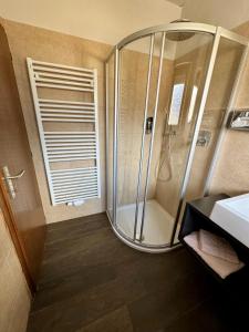 a bathroom with a shower and a sink at Hotel Residence MaVie in Lagundo