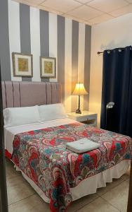 A bed or beds in a room at Hostal Rio Piedra