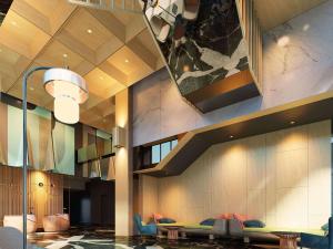 een lobby van een hotel met een wachtkamer bij ibis Styles Serpong BSD City in Tangerang