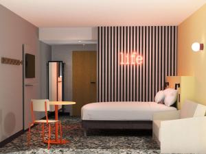 En eller flere senge i et værelse på greet Hotel Paris 13 Porte d'Italie