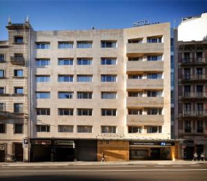 a large building on the corner of a street at HCC Montblanc in Barcelona