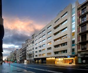 a large building on a city street at night at HCC Montblanc in Barcelona
