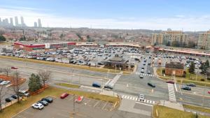 an aerial view of a parking lot in a city at Luxurious and spacious 3 bedroom apartment in Mississauga