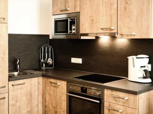 Kuchyň nebo kuchyňský kout v ubytování Appartements Rosenhof
