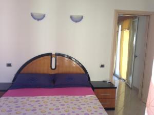 Postel nebo postele na pokoji v ubytování Villa George