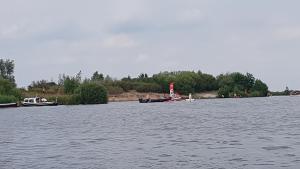 a group of boats floating on a large body of water at Camping Eefting in Rohel +2 photos