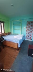 Posteľ alebo postele v izbe v ubytovaní Nitwal Home Stay