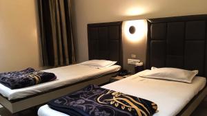 Кровать или кровати в номере Hotel RamNiwas