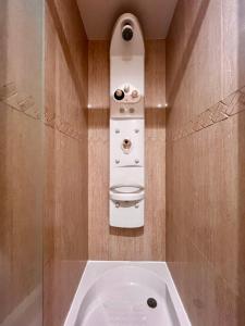a bathroom with a bath tub with a sink at 29 Floor. Home Suite Home in Santa Cruz de Tenerife
