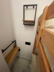a staircase in a room with a mirror and a ladder at WISH SUITE PONCE DE LEON in Seville