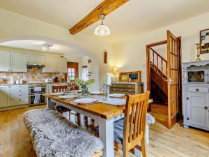 a kitchen with a table and chairs in a room at 4 Bed in Hereford 44213 in Hereford