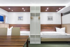 Postel nebo postele na pokoji v ubytování Hotel Alea City